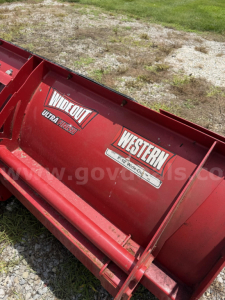 GMC Sierra 3500HD snow plow attachment showing Western and WIDECUT Ultra Finish logos on red blade.