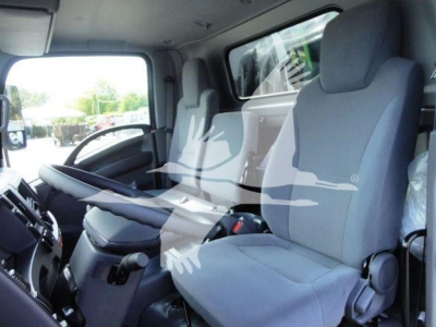 Isuzu NPR-HD cab interior showing driver and passenger seats and dashboard.