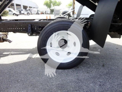 Isuzu NPR-HD truck chassis showing front wheel and suspension components