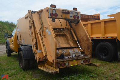 Ford F-550 Super Duty Packer Truck rear view showing trash compactor body and taillights