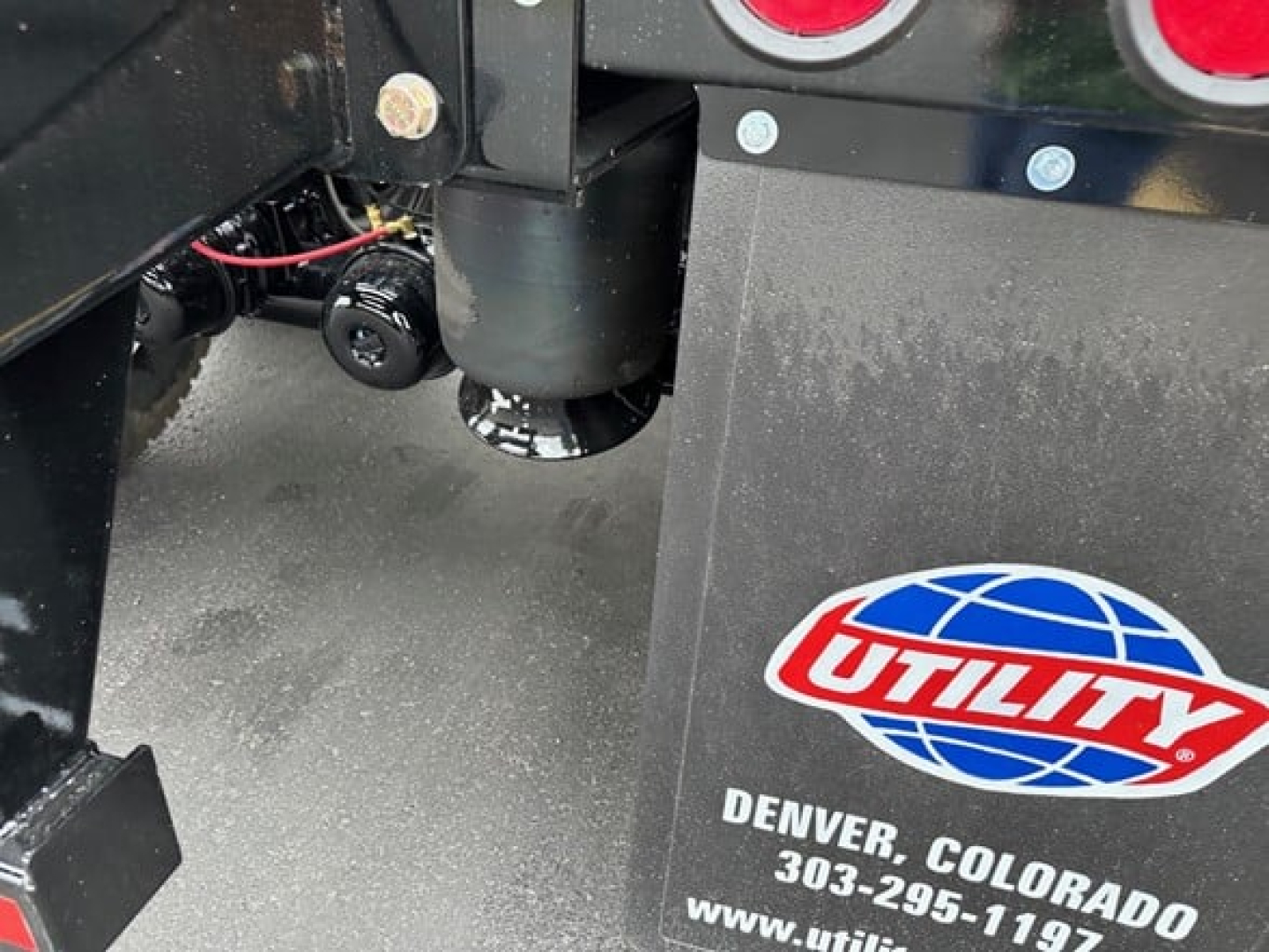 Tag on a Jet Side Dump trailer showing utility logo and Colorado Denver location sticker with circular red and blue emblem.