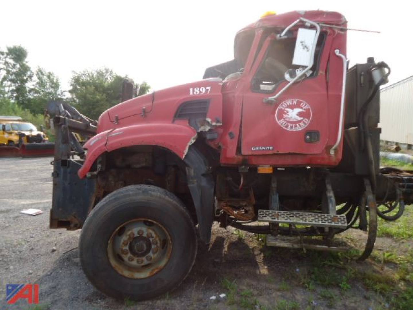2005 Mack Granite CV713 Dump Truck Cab and Chassis showing damaged front end and wheel, red cab with Mack logo badge and side graphic.