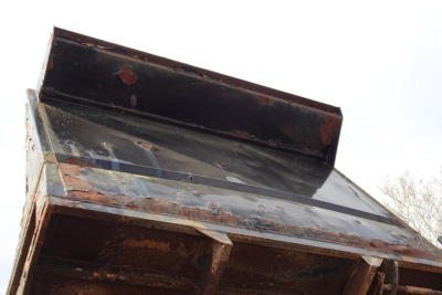Dump truck bed with metal sides and rusted interior, angled upward, Mitsubishi FH listing image.