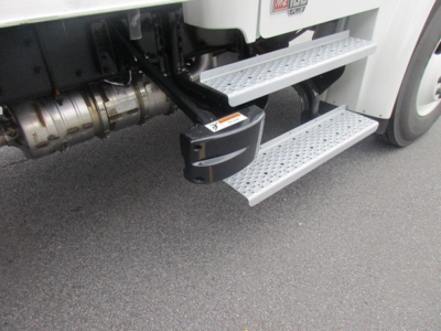 Freightliner M2 106 Plus side steps and rear engine area visible