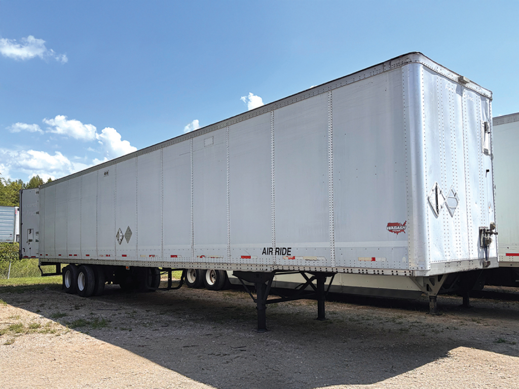 Long white 2005 Wabash DuraPlate trailer with landing gear, dual rear wheels, side lettering and Diamond logos; no visible cab.
