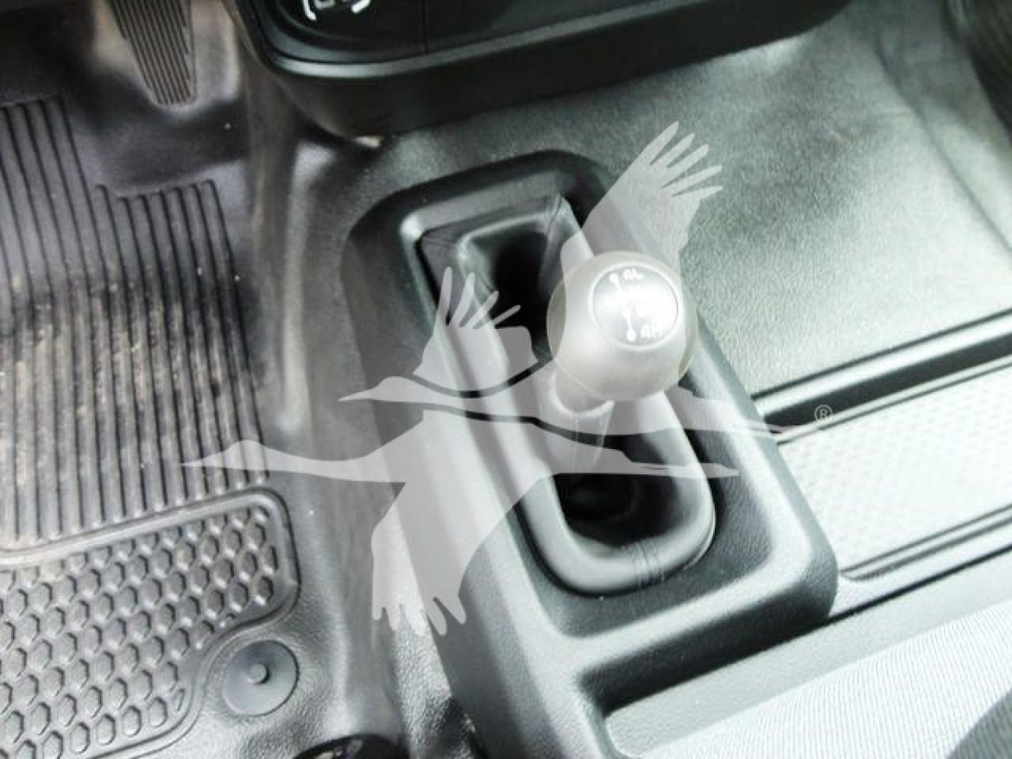 Ram 4500 engine bay showing 12V auxiliary power outlet with protective cover and surrounding trim.