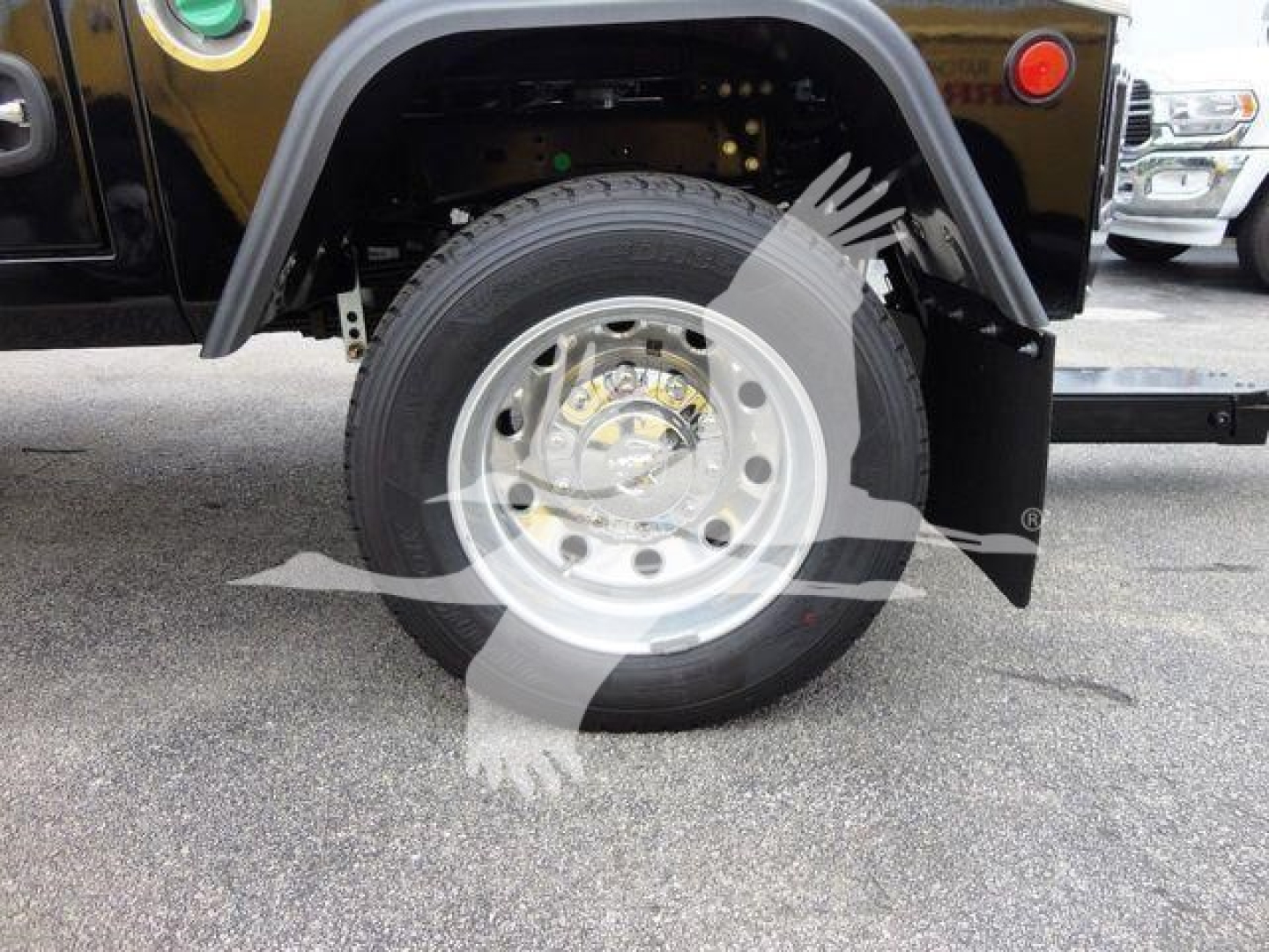 Wheel and fender area of a Ram 4500 truck showing front wheel, tire, and fender well with part of a winch setup.
