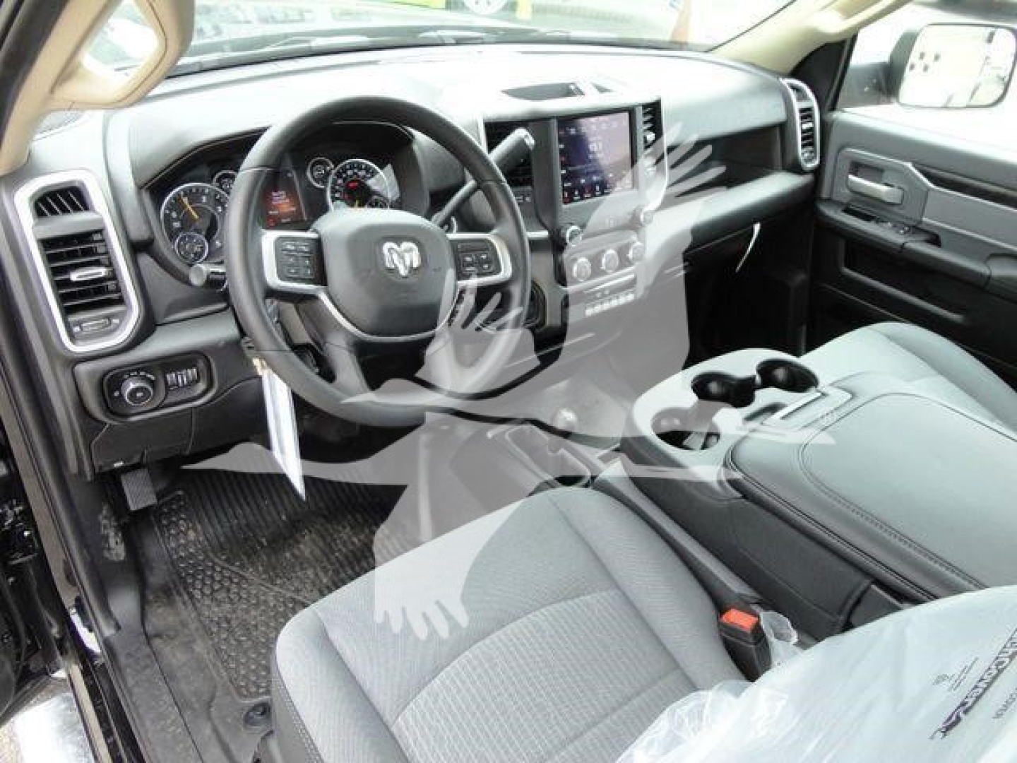 Ram 4500 SLT truck interior showing steering wheel, center console, and dashboard with infotainment screen.