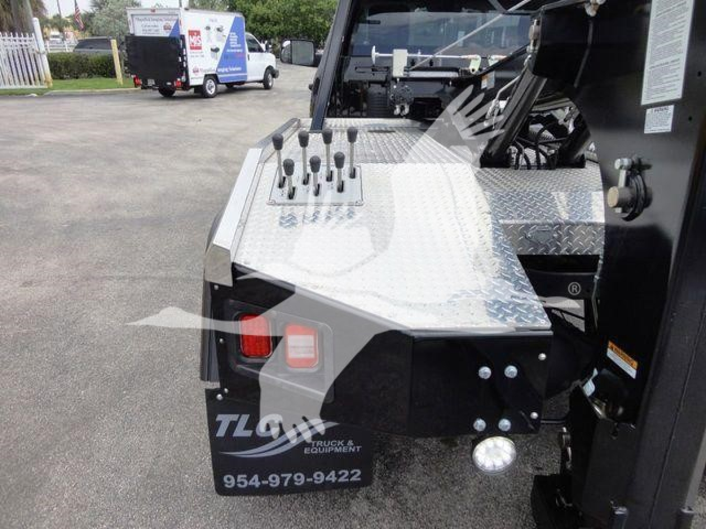 Ram 4500 winch-equipped truck front fender area with diamond-plate surface and control levers visible