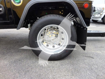 Wheel and fender area of a Ram 4500 truck showing front wheel, tire, and fender well with part of a winch setup.