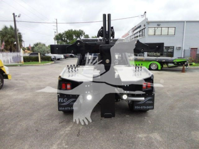 Truck rear view showing winch system and hitch with mounting arms on Ram 4500 SLT, stock J68872, category winch, new vehicle.