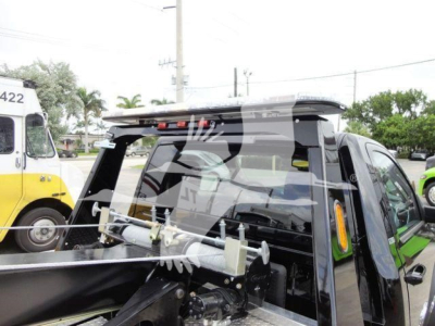 Ram 4500 SLT pickup with winch setup in truck bed, rear cab view, winch mounting hardware visible.