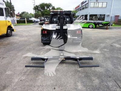 Ram 4500 SLT winch-equipped truck rear view showing heavy-duty winch setup and mounting hardware.