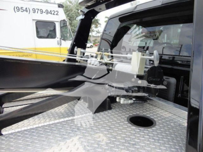 Ram 4500 pickup bed with winch system and diamond plate surface in truck bed area.