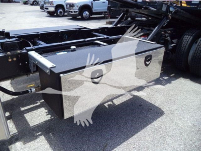Utility toolbox mounted on a Hino L6 rollback truck chassis with storage box and mounting hardware visible.