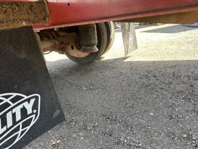  Fontaine spread air combo drop deck trailer undercarriage with wheel and mudflap visible.