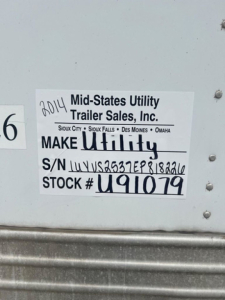 Sticker on trailer showing Make Utility, S/N 1UYVS2537EP818226, STOCK # U91079, MID-STATES UTILITY TRAILER SALES, INC. with 2014 handwritten year.