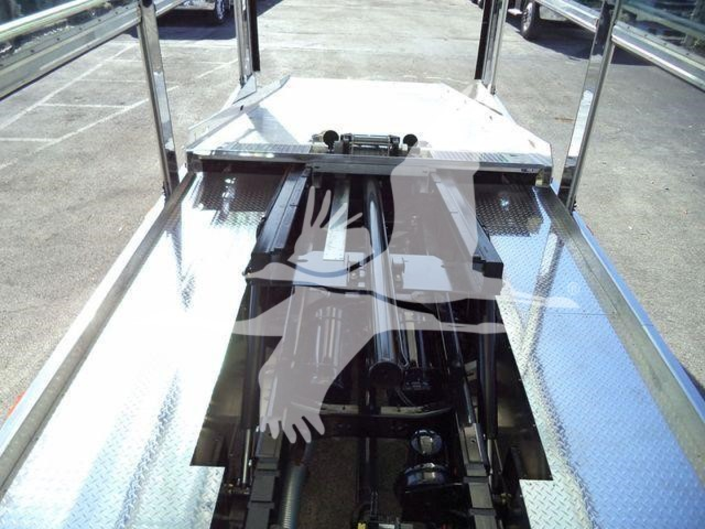 Truck bed/storage platform showing chrome railing and Diamond plate diamond-metal surface on trailer/rollback unit for a 2025 Kenworth T280.