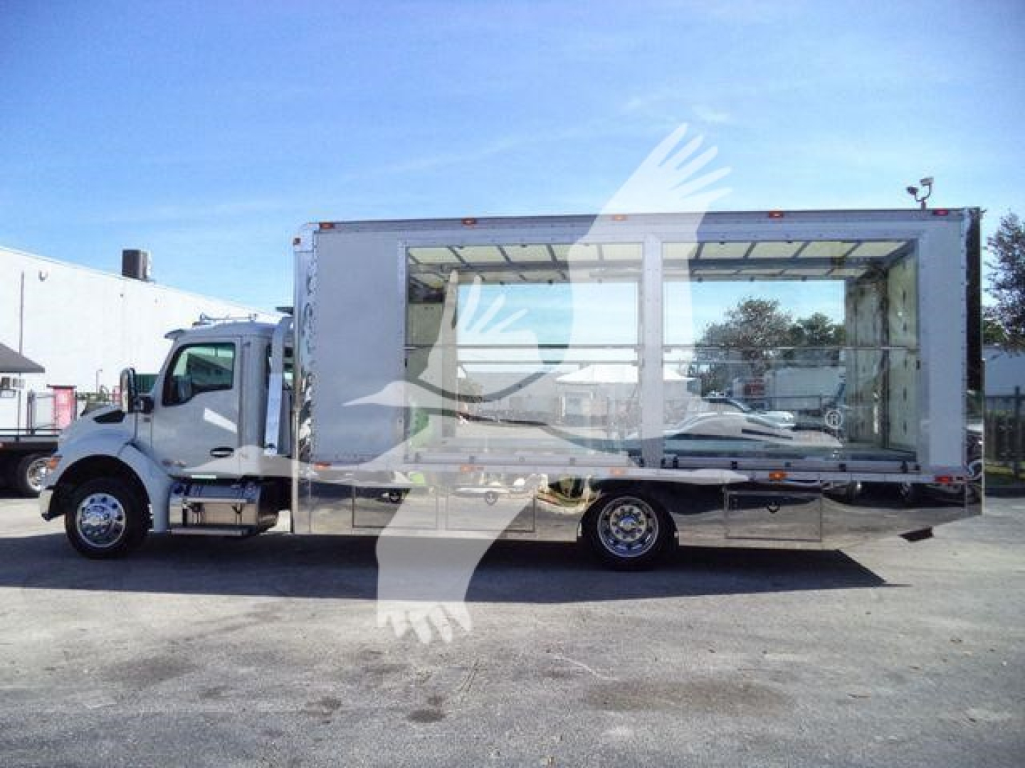 Kenworth T280 rollback truck side view showing large empty cargo box and cab with Dual rear wheels.