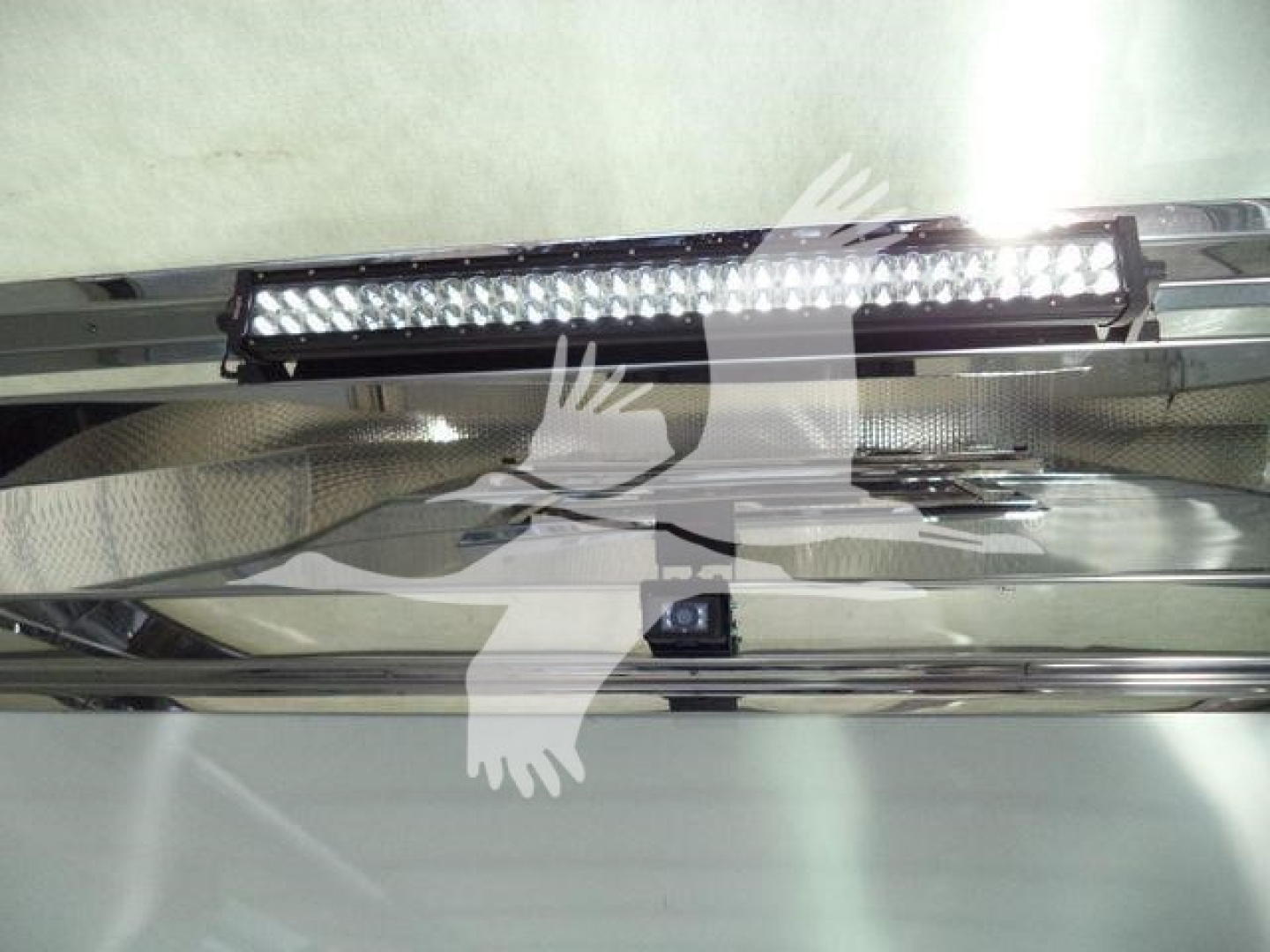 LED light bar mounted on chrome bumper of a 2025 Kenworth T280 rollback truck in new condition showing a close view