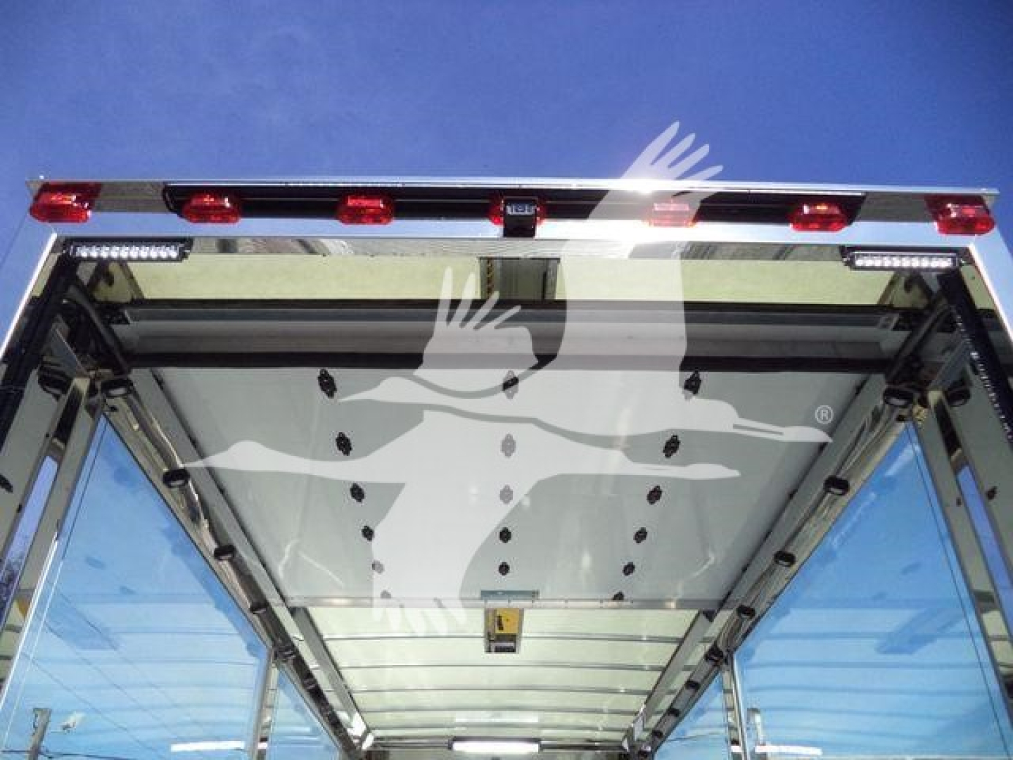 Kenworth T280 rollback truck body rear view showing reflective chrome frame and rear lights.