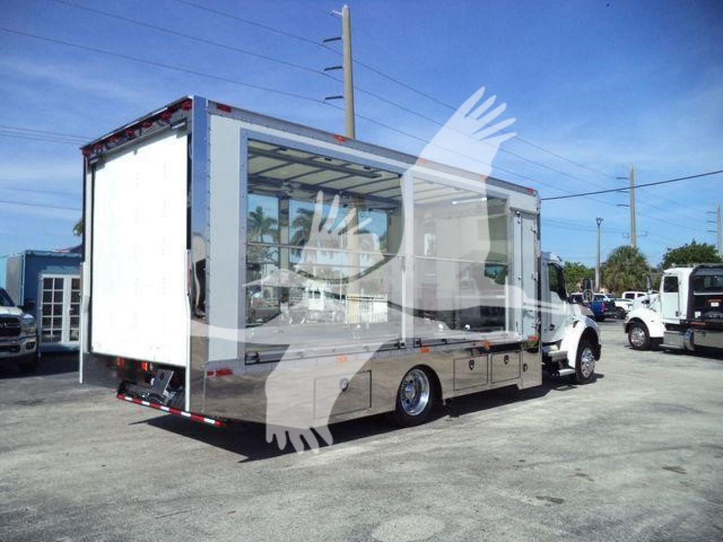 Kenworth T280 rollback truck with open cargo area and cab visible, side view shows chrome details and rear loading area.