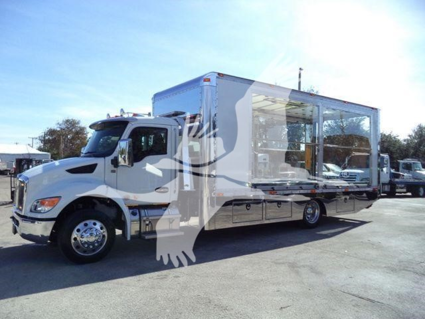 Kenworth T280 rollback truck with a large enclosed trailer, side view showing cab and wheel, chrome wheels, white exterior.