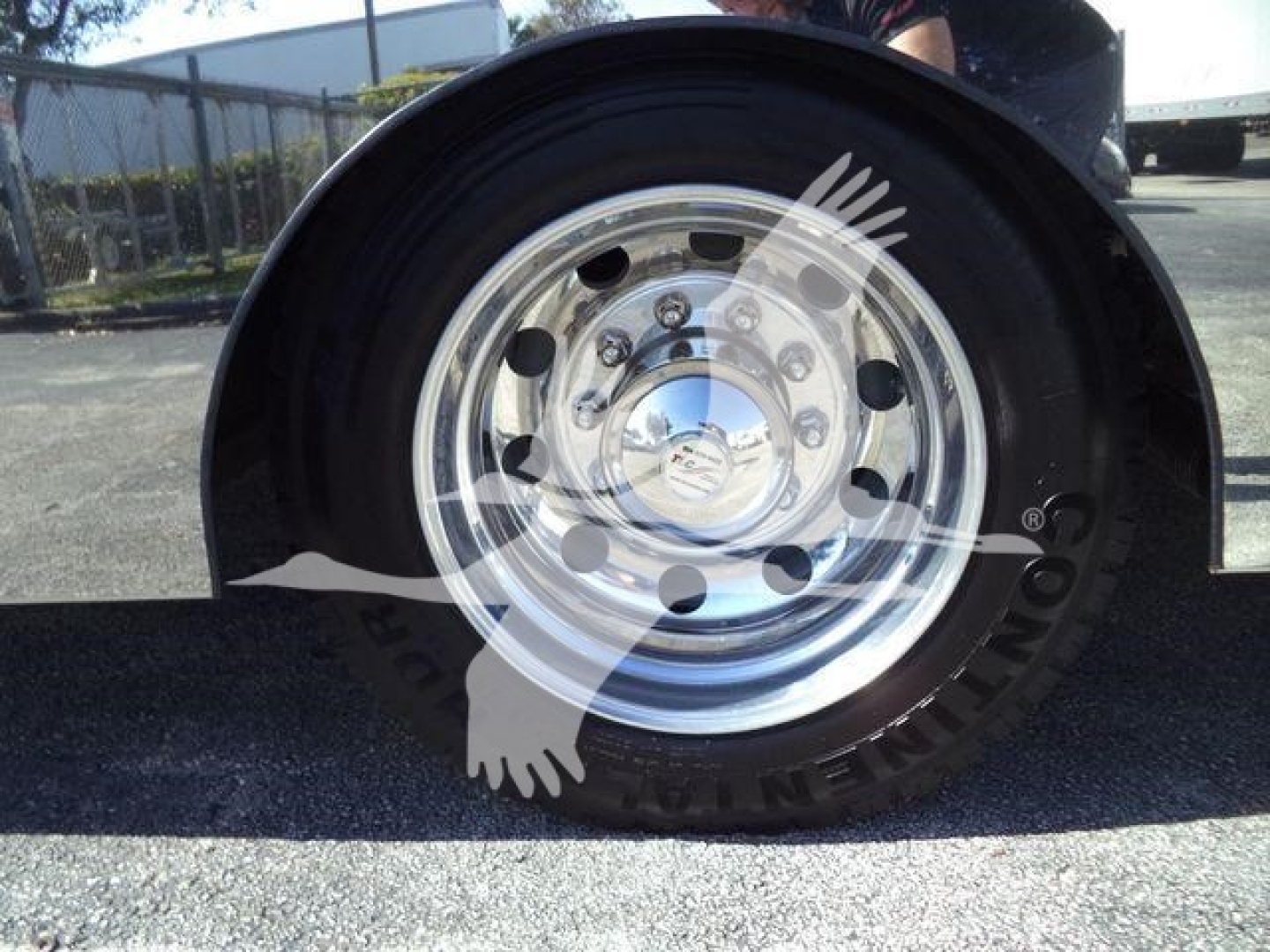 Kenworth T280 rollback truck wheel and polished aluminum hubcap visible