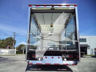 Kenworth T280 rollback truck rear view showing cargo area and taillights.