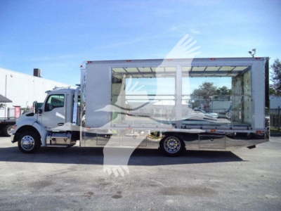 Kenworth T280 rollback truck side view showing large empty cargo box and cab with Dual rear wheels.
