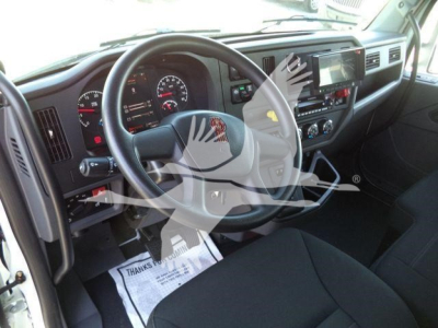 Kenworth T280 interior view showing steering wheel, dashboard gauges, and center console.