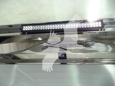LED light bar mounted on chrome bumper of a 2025 Kenworth T280 rollback truck in new condition showing a close view