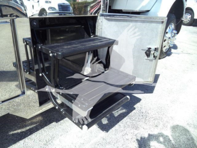 Kenworth T280 rollback truck with side step and storage pull-out drawer visible in open side compartment.