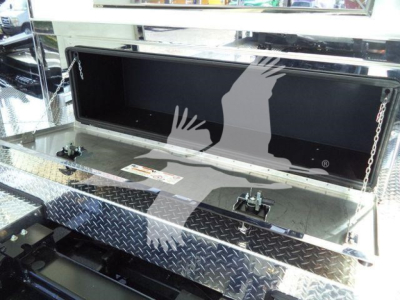 Kenworth T280 rollback bed toolbox open showing aluminum diamond plate step and storage compartment.