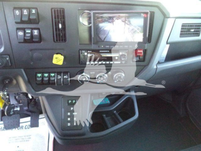 Kenworth T680/KB5 dashboard showing infotainment screen and control panel with gear selector