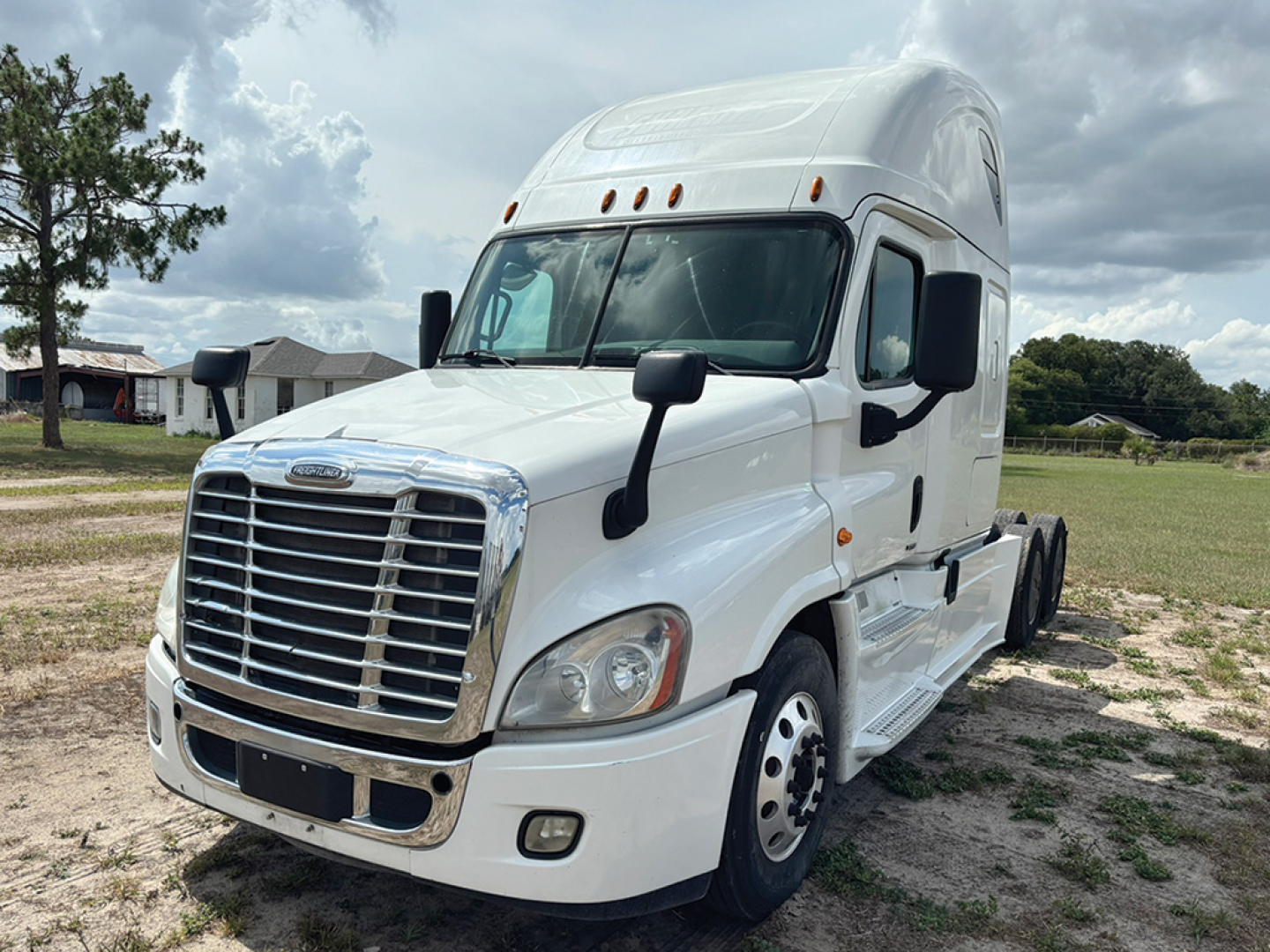 Truck image: white 2017 Freightliner Cascadia 125 Evolution tractor with chrome grille, front headlights, and dual rear axle, side mirrors, and sleeper cab.