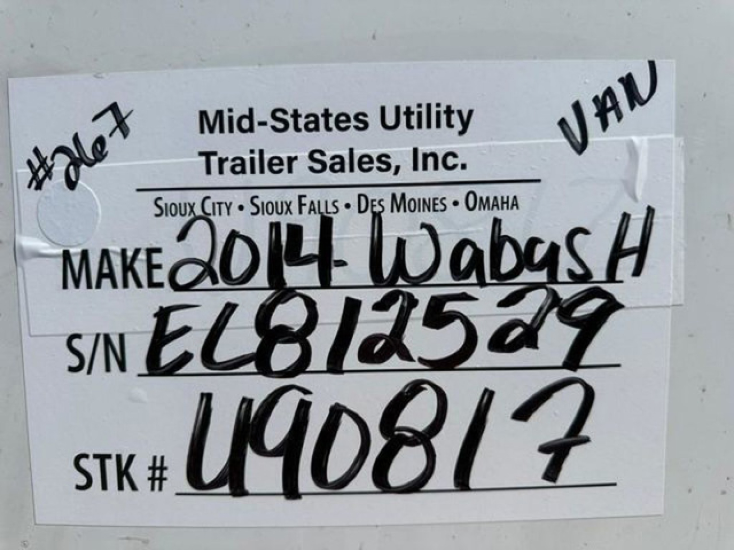 Trailer tag with handwritten VIN and stock number. Tag reads: Mid-States Utility Trailer Sales, Inc. Sioux City-Sioux Falls-Des Moines-Omaha. MAKE 2014 Wabash H S/N EL812529 STK# U90817. #407 on left. VAN note at top right.