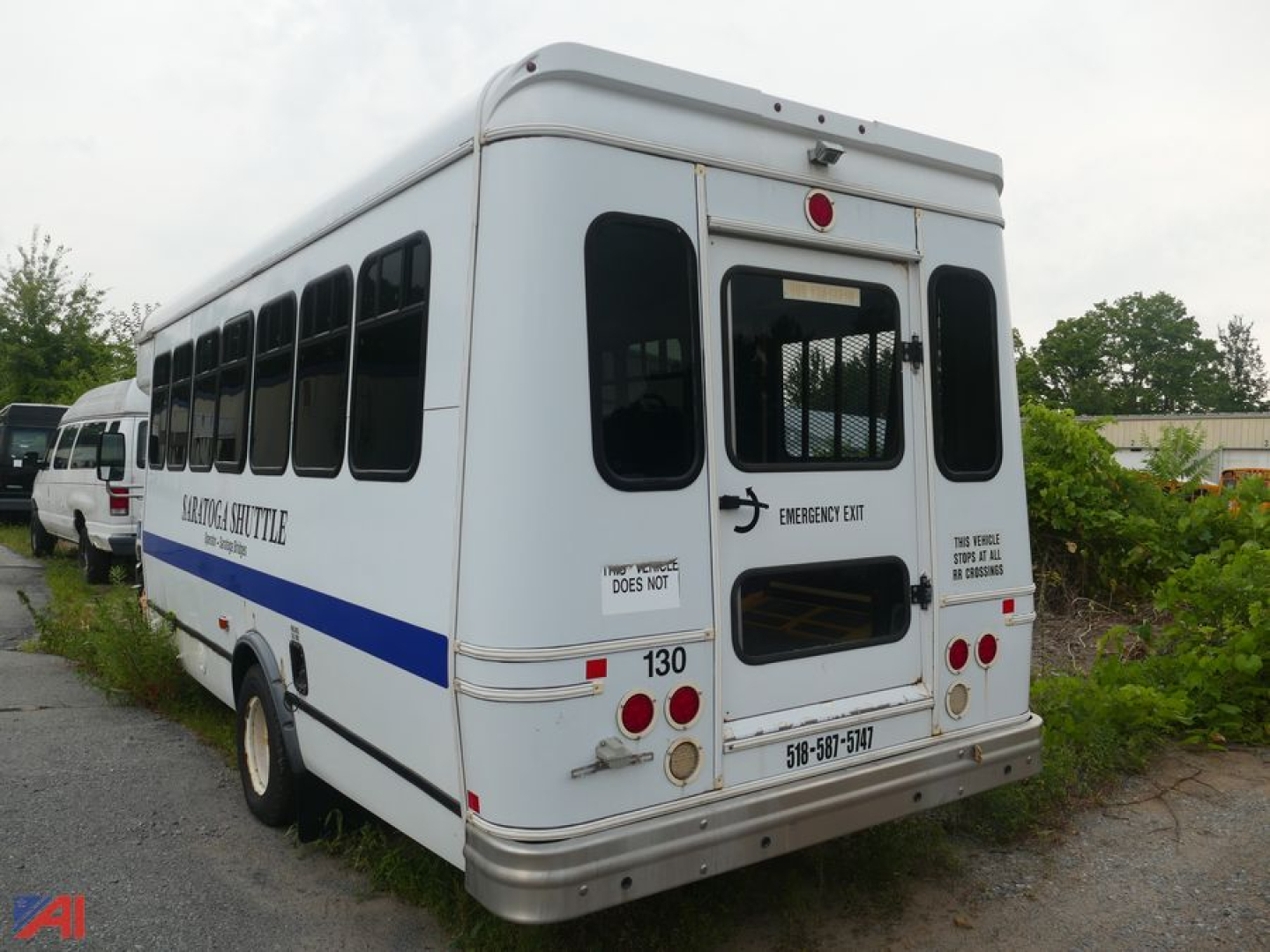 Ford Econoline E450 mini bus rear showing wheelchair lift door and emergency exit markings