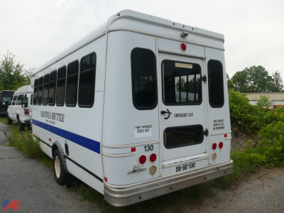 Ford Econoline E450 mini bus rear showing wheelchair lift door and emergency exit markings