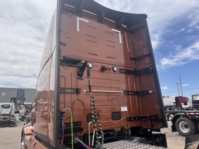 Mack PR64T76H sleeper truck cab interior rear wall with latches and wiring visible.