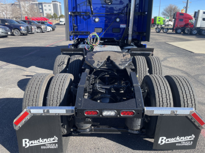 Mack PR64T76H tractor rear chassis showing dual rear axles and mud flaps with Bruckner's branding.