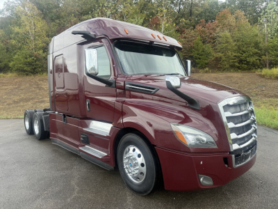 Freightliner Cascadia125/126 sleeper tractor in maroon showing front grille, headlights, mirrors, and dual rear axles.