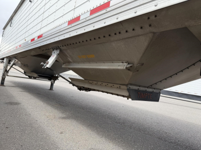 Timpte Super Hopper trailer underside view showing bottom access panel and Timpte branding undercarriage.