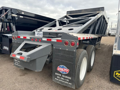 Truck trailer in a yard showing a 40' bottom-dump frame with dual rear axles and a Utility trailer logo. Visible text includes DENVER COLORADO, 303-295-1197, www.utilitytrailer.net on the mudguard; plate number C449660; other labels and war