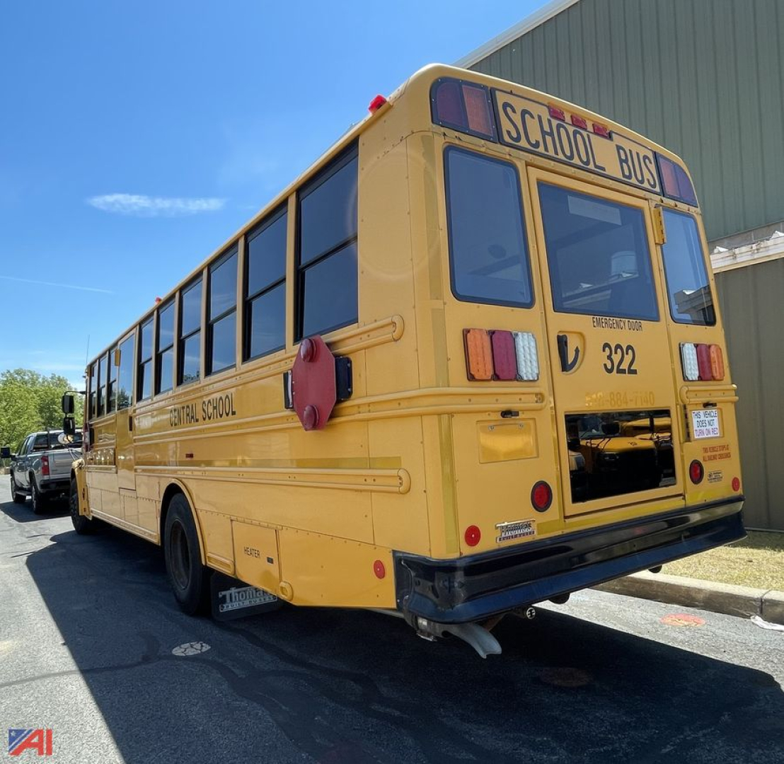 School bus rear view showing 'SCHOOL BUS' sign, Freightliner C2, bus number 322, Emergency exit door, yellow exterior.