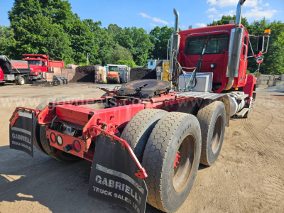 Truck chassis view showing rear 6x4 axles and red Mack CH613 cab, with tires and rear bumper plates labeled Gabriel Truck Sales.