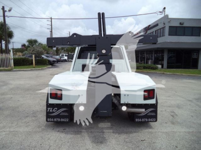 Ram 4500 tow truck chassis rear view with winch carrier and dual taillights.