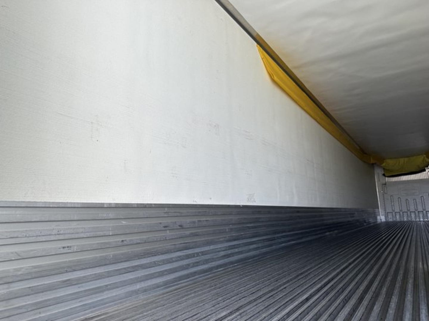 Trailer interior showing aluminum floor ribs and sidewalls inside a 2022 Utility 3000R reefer trailer.