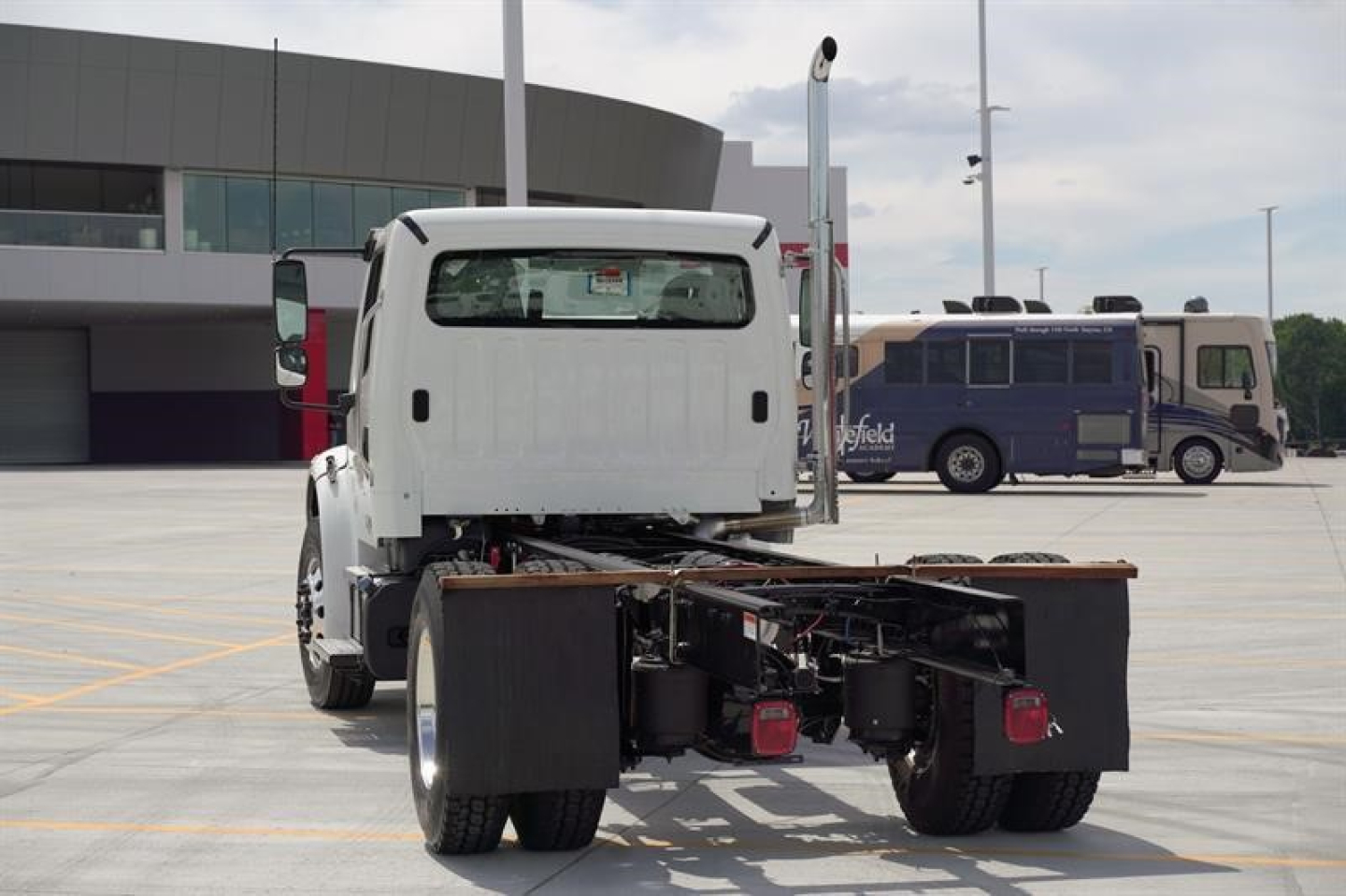 Freightliner Business Class M2 106 Plus cab and chassis rear view showing chassis frame and rear components.
