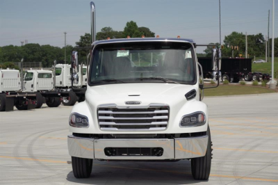 Front view of a white Freightliner Business Class M2 106 Plus cab and chassis truck, with chrome grille, large side mirrors, and black front bumper, parked on a lot.